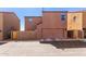 Townhome features a private garage, well-kept facade, and convenient street access at 8244 W Albeniz Pl, Phoenix, AZ 85043