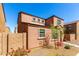 Side view of the property showing a well-maintained landscape with a block wall at 8244 W Albeniz Pl, Phoenix, AZ 85043