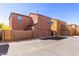 Attached homes, each with a private garage, boast a well-maintained exterior and street parking at 8244 W Albeniz Pl, Phoenix, AZ 85043