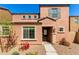 Charming two-story home with a low maintenance front yard and covered entryway at 8244 W Albeniz Pl, Phoenix, AZ 85043
