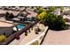 Community view of home and neighborhood playground with manicured lawns and mature trees at 9052 E Hobart St, Mesa, AZ 85207