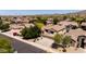 Gathering-friendly neighborhood featuring a two-story home with a three-car garage and manicured lawns in a desirable location at 9052 E Hobart St, Mesa, AZ 85207