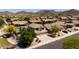 Desirable community, showcasing a two-story home with a three-car garage, nestled among other well-maintained properties at 9052 E Hobart St, Mesa, AZ 85207