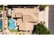 Bird's-eye view of a home featuring a kidney-shaped pool, patio area, and well-maintained landscaping in a residential neighborhood at 9052 E Hobart St, Mesa, AZ 85207