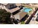 Inviting backyard featuring a sparkling pool, covered patio, seating area, and lush landscaping for outdoor enjoyment at 9052 E Hobart St, Mesa, AZ 85207
