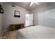 Bedroom featuring a closet and sliding barn door storage, creating a serene retreat at 9052 E Hobart St, Mesa, AZ 85207