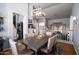 Open-concept dining area with modern lighting and easy access to the kitchen, great for entertaining at 9052 E Hobart St, Mesa, AZ 85207
