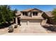 Attractive two-story home with a three-car garage, mature landscaping, and a well-manicured lawn at 9052 E Hobart St, Mesa, AZ 85207