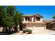 Charming two-story home with a well-manicured lawn and a two car garage at 9052 E Hobart St, Mesa, AZ 85207