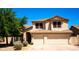 Charming two-story home with a well-manicured lawn and a two car garage at 9052 E Hobart St, Mesa, AZ 85207