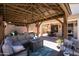 Relaxing backyard gazebo featuring comfortable lounge seating and stylish decor at 9052 E Hobart St, Mesa, AZ 85207