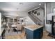 Kitchen view featuring a large island, with a dining area, and staircase to a loft in an open floorplan at 9052 E Hobart St, Mesa, AZ 85207