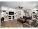 Spacious living room with custom built-in shelves and a comfortable sectional sofa at 9052 E Hobart St, Mesa, AZ 85207
