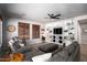 Relaxing living room with large sofa, built-in shelving, and decorative touches for a cozy feel at 9052 E Hobart St, Mesa, AZ 85207