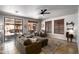 Inviting living room with comfortable seating, sliding glass doors to the patio, and neutral color scheme at 9052 E Hobart St, Mesa, AZ 85207