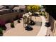 Community playground with modern play equipment, surrounded by desert landscaping, flowers, and walking paths in a residential area at 9052 E Hobart St, Mesa, AZ 85207