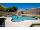 Sparkling backyard pool with artificial turf and surrounding patio, perfect for outdoor enjoyment at 9052 E Hobart St, Mesa, AZ 85207