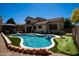 Backyard view of the sparkling pool, gazebo, and artificial turf at 9052 E Hobart St, Mesa, AZ 85207
