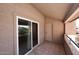 Private balcony with sliding glass doors and tile flooring, perfect for relaxing outdoors at 10828 N Biltmore Dr # 230, Phoenix, AZ 85029