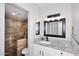 Bathroom featuring granite counters, a modern sink, and a tiled glass-enclosed shower at 10828 N Biltmore Dr # 230, Phoenix, AZ 85029