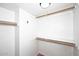 Walk-in closet features multiple shelves and ample storage at 10828 N Biltmore Dr # 230, Phoenix, AZ 85029