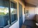 Cozy condo entry featuring a secure door, window and neutral wall, with potted plant at 10828 N Biltmore Dr # 230, Phoenix, AZ 85029
