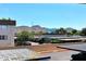 Scenic view from the condo overlooking mountains, trees, and parking under a bright blue sky at 10828 N Biltmore Dr # 230, Phoenix, AZ 85029