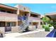 Attractive apartment complex with well-maintained landscaping and a clear blue sky in the background at 10828 N Biltmore Dr # 230, Phoenix, AZ 85029