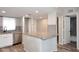 The kitchen island is a focal point and includes stainless steel appliances and granite countertops at 10828 N Biltmore Dr # 230, Phoenix, AZ 85029