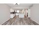 Bright kitchen features white cabinets, granite countertops, stainless steel appliances, and an open layout to dining area at 10828 N Biltmore Dr # 230, Phoenix, AZ 85029