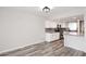 Well-lit kitchen offers stainless steel appliances, granite countertops, subway tile backsplash, and light-colored cabinets at 10828 N Biltmore Dr # 230, Phoenix, AZ 85029
