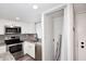 The well-equipped kitchen has modern appliances, and a convenient laundry closet is adjacent at 10828 N Biltmore Dr # 230, Phoenix, AZ 85029