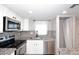 The kitchen features a stainless steel dishwasher, granite counters, and stainless steel appliances at 10828 N Biltmore Dr # 230, Phoenix, AZ 85029