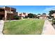 Expansive green lawn offering a peaceful and relaxing view for residents at 10828 N Biltmore Dr # 230, Phoenix, AZ 85029