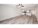 Open-concept living space with wood floors connecting living area to modern kitchen at 10828 N Biltmore Dr # 230, Phoenix, AZ 85029