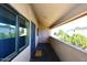 Comfortable outdoor patio space featuring a secure entry door and shaded area at 10828 N Biltmore Dr # 230, Phoenix, AZ 85029
