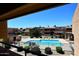 Enjoy the community pool with lounge seating surrounded by lush landscaping at 10828 N Biltmore Dr # 230, Phoenix, AZ 85029