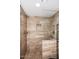 Walk-in tiled shower featuring dual shower heads and a built in niche at 10828 N Biltmore Dr # 230, Phoenix, AZ 85029