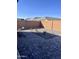 Low-maintenance backyard with rock landscaping, pavers, block wall, and desert plants at 11074 W Tonto St, Avondale, AZ 85323