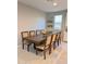 Elegant dining room features a large wooden table with seating for eight at 11074 W Tonto St, Avondale, AZ 85323