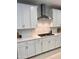 Modern kitchen with white cabinetry, stainless steel appliances, and stylish subway tile backsplash at 11074 W Tonto St, Avondale, AZ 85323