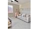 Bright living room with neutral tones, sliding glass doors, and comfortable seating at 11074 W Tonto St, Avondale, AZ 85323