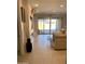 Bright living room with neutral tones, sliding glass doors, and comfortable seating at 11074 W Tonto St, Avondale, AZ 85323
