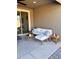 Relaxing outdoor patio with modern furniture, a ceiling fan, and a sliding glass door at 11074 W Tonto St, Avondale, AZ 85323