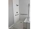 Modern shower space with white tiled walls, and a seat at 11074 W Tonto St, Avondale, AZ 85323