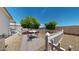 Private backyard with white picket fence, patio set, desert landscaping, and mature citrus trees at 11596 W Sierra Dawn Blvd # 33, Surprise, AZ 85378