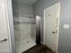 Bathroom with tiled shower featuring glass door and modern fixtures at 11596 W Sierra Dawn Blvd # 33, Surprise, AZ 85378