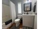 Cozy bathroom featuring a white vanity with a black framed mirror, a toilet, and a shower/tub with a white curtain at 11596 W Sierra Dawn Blvd # 33, Surprise, AZ 85378