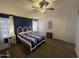 Comfortable bedroom features dual windows, ceiling fan, and blue-themed decor at 11596 W Sierra Dawn Blvd # 33, Surprise, AZ 85378