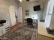 Inviting bedroom featuring a stylish rug, built-in desk, and ample natural light, ideal for work or relaxation at 11596 W Sierra Dawn Blvd # 33, Surprise, AZ 85378